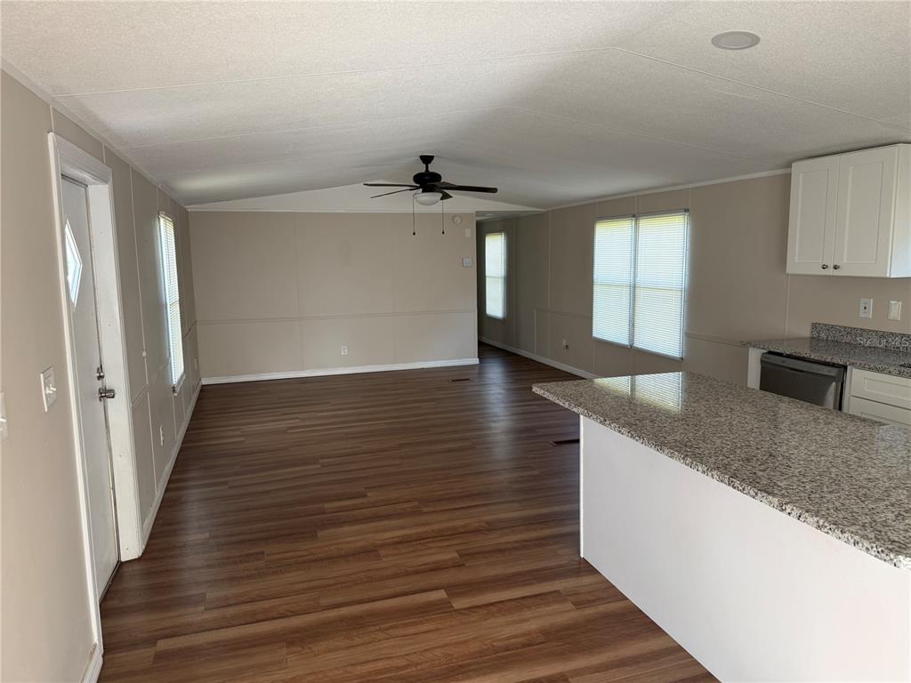 4113 Shady View Run Mulberry, FL 33860 - Photo 7 of 17 wooden floor in an empty room with a window