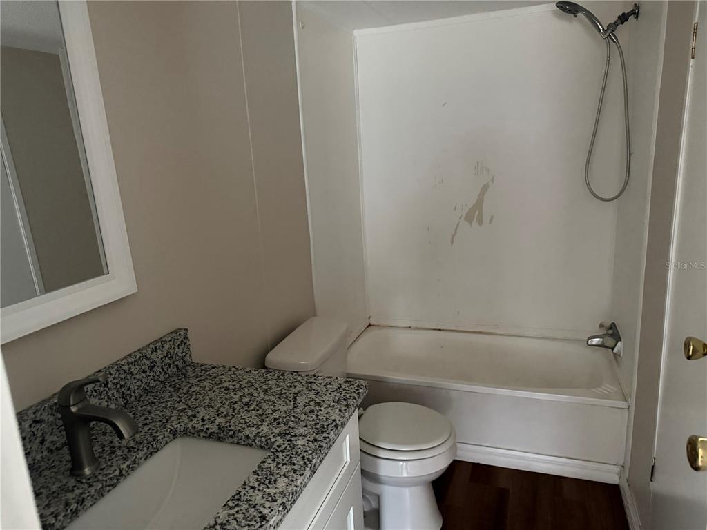 4113 Shady View Run Mulberry, FL 33860 - Photo 9 of 17 a bathroom with a toilet and a shower