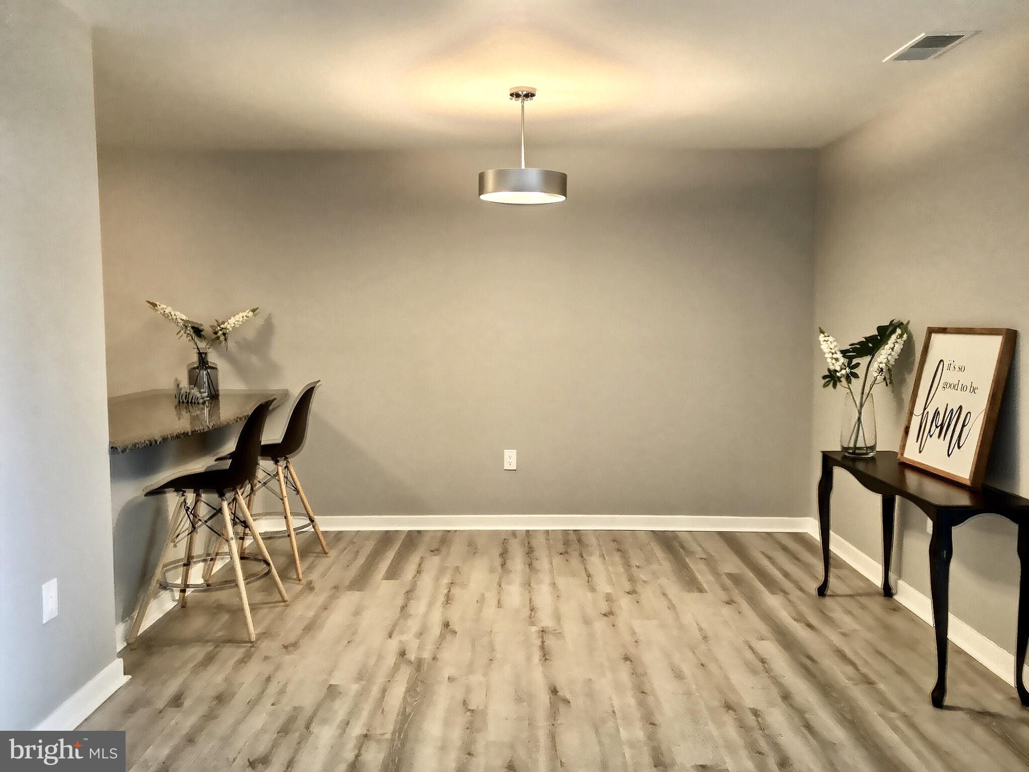 413 Sharp Street South, Unit R7 Baltimore, MD 21230 - Photo 11 of 31 Large dining space with gorgeous new floors