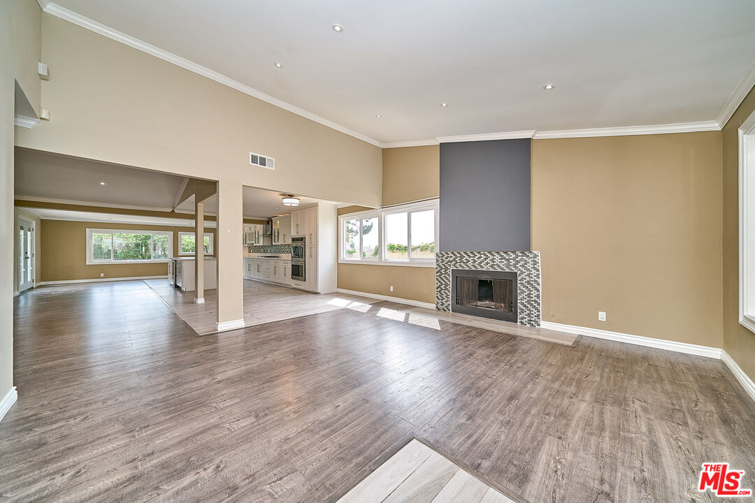 2660 Conata Street Duarte, CA 91010 - Photo 15 of 64 a view of an empty room with a fireplace and window