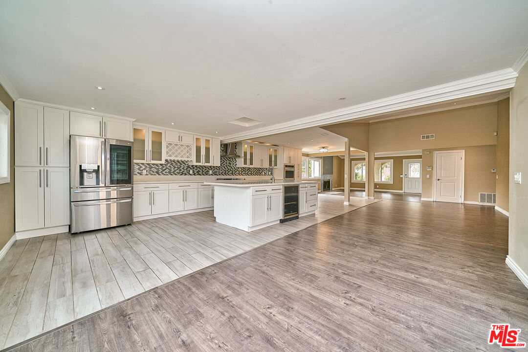 2660 Conata Street Duarte, CA 91010 - Photo 19 of 64 a kitchen with wooden floors and refrigerator