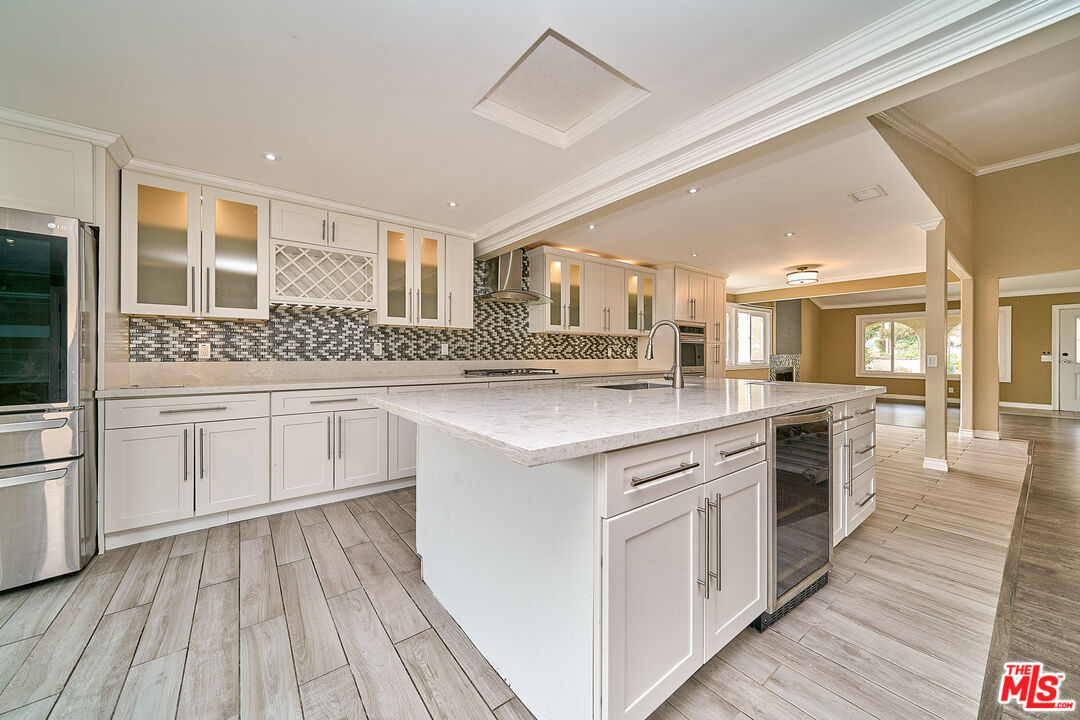 2660 Conata Street Duarte, CA 91010 - Photo 23 of 64 a kitchen with stainless steel appliances granite countertop a stove and cabinets