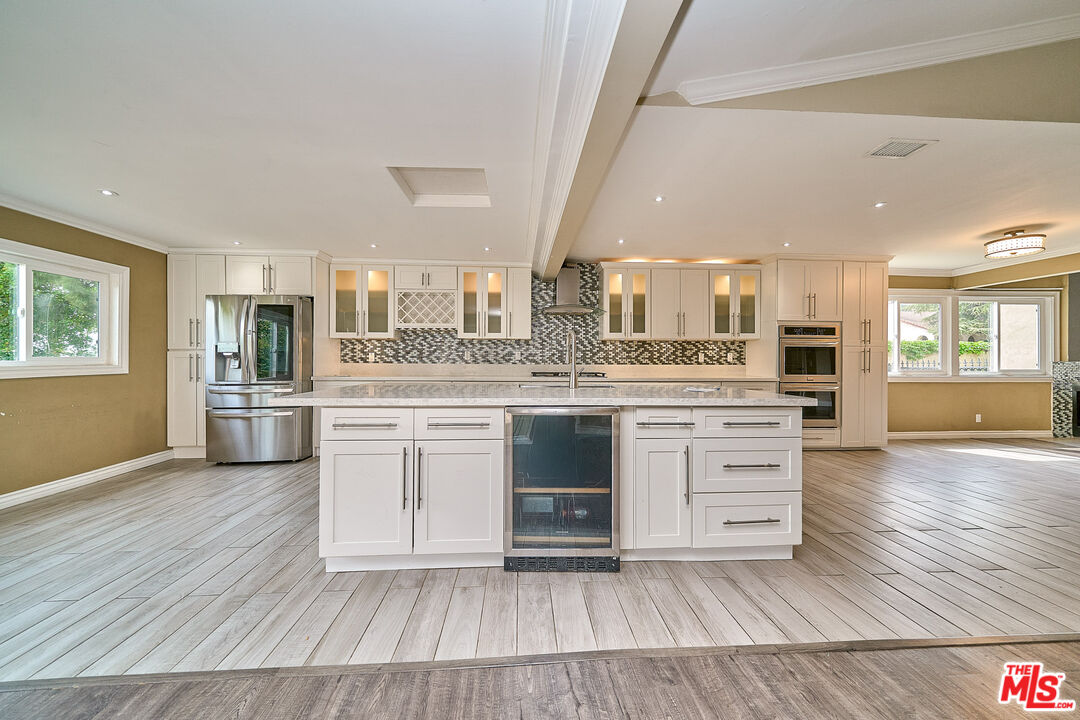 2660 Conata Street Duarte, CA 91010 - Photo 24 of 64 a kitchen with stainless steel appliances a stove a sink dishwasher a refrigerator and a oven with wooden floor