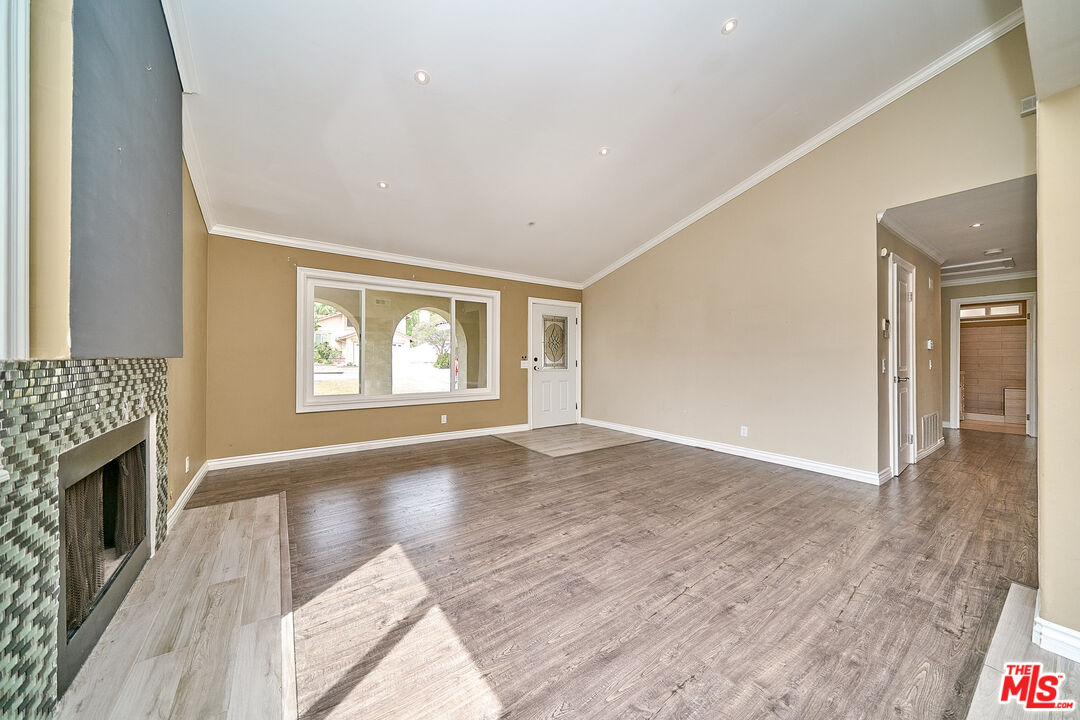 2660 Conata Street Duarte, CA 91010 - Photo 26 of 64 a view of an empty room with a window and wooden floor