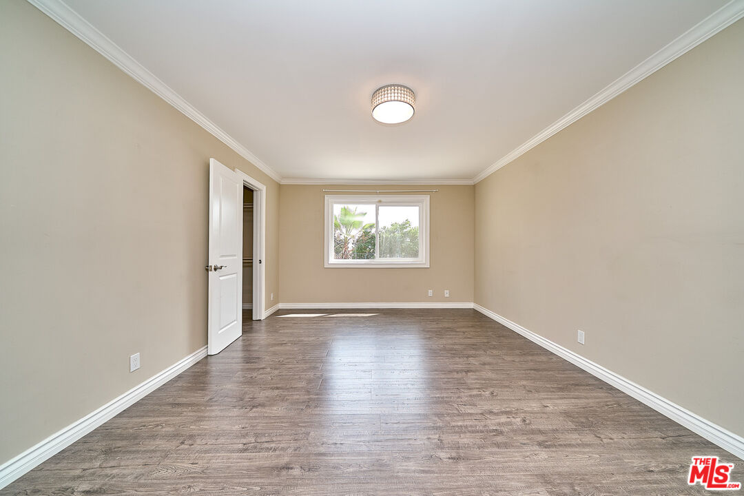 2660 Conata Street Duarte, CA 91010 - Photo 27 of 64 an empty room with wooden floor and windows