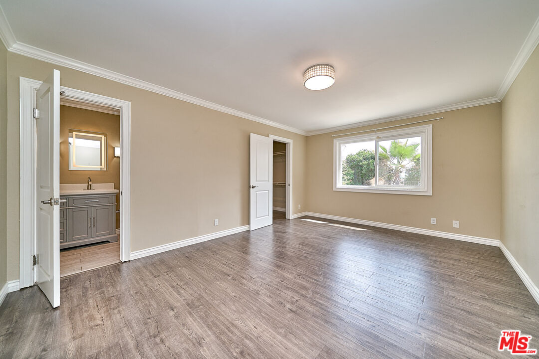2660 Conata Street Duarte, CA 91010 - Photo 28 of 64 an empty room with wooden floor cabinet and windows