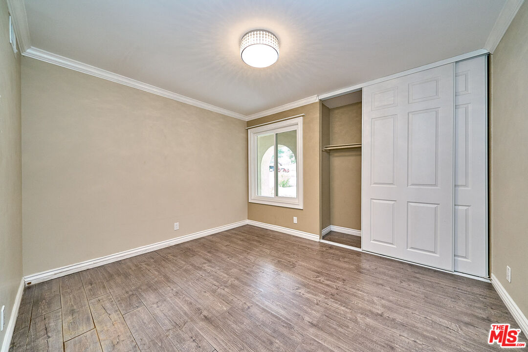 2660 Conata Street Duarte, CA 91010 - Photo 36 of 64 a view of an empty room with wooden floor and window