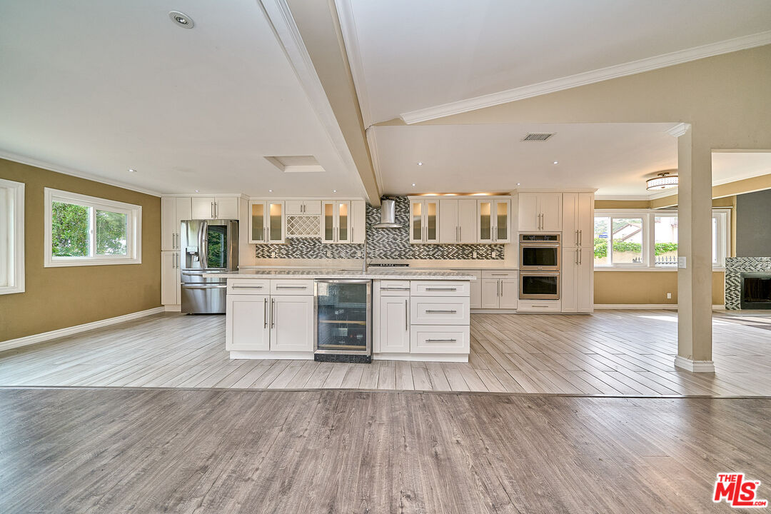 2660 Conata Street Duarte, CA 91010 - Photo 47 of 64 a large kitchen with stainless steel appliances wooden floors and view living room