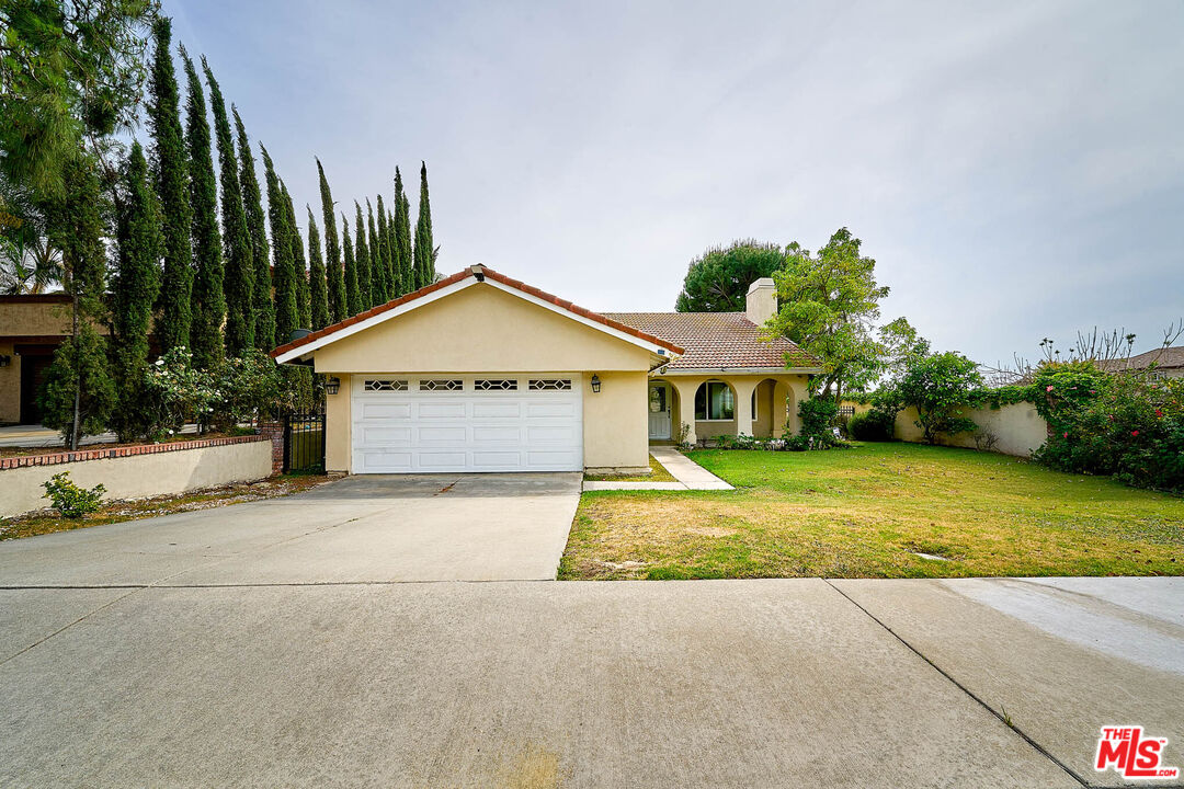 2660 Conata Street Duarte, CA 91010 - Photo 56 of 64 a view of a house with a yard and potted plants