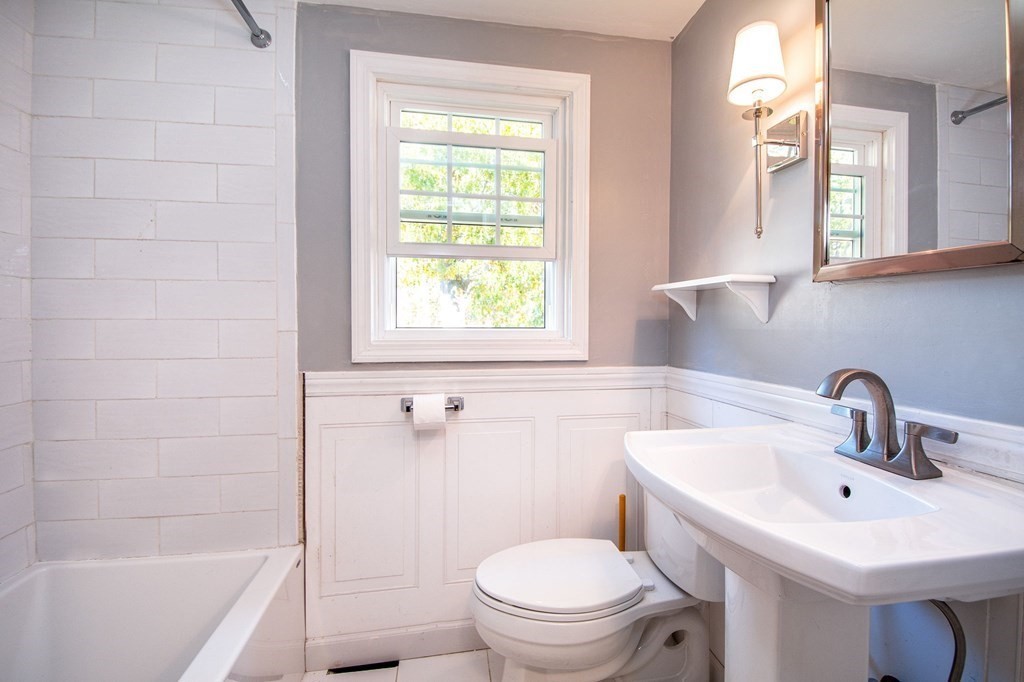 226 Beaver Dam Road Scituate, MA 02066 - Photo 11 of 12 a bathroom with a sink toilet a mirror and shower