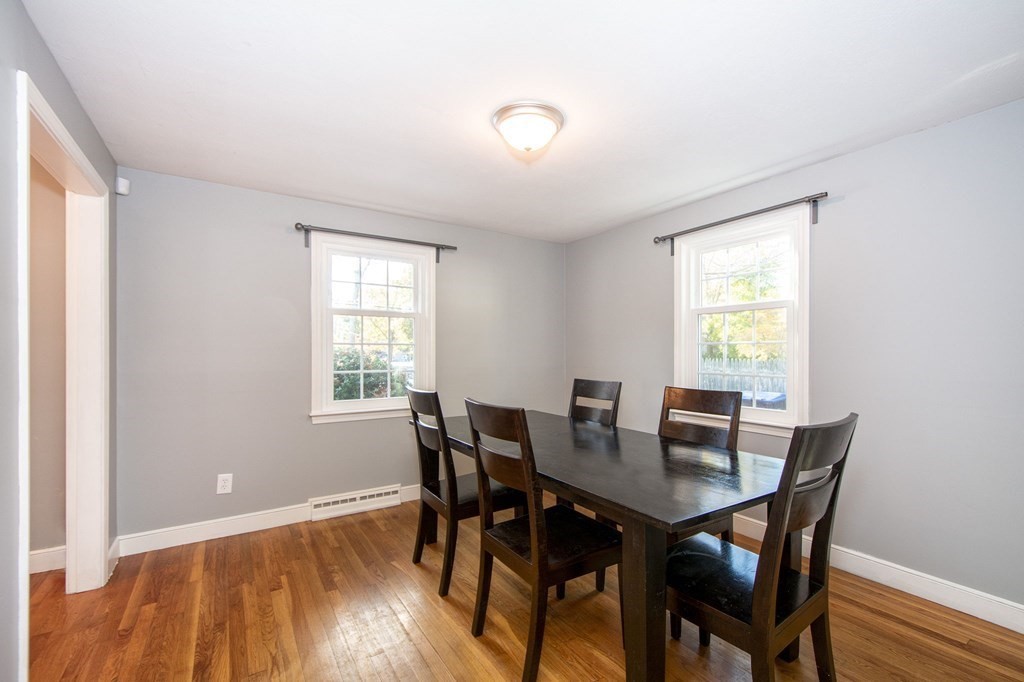 226 Beaver Dam Road Scituate, MA 02066 - Photo 4 of 12 a view of a dining room with furniture and wooden floor