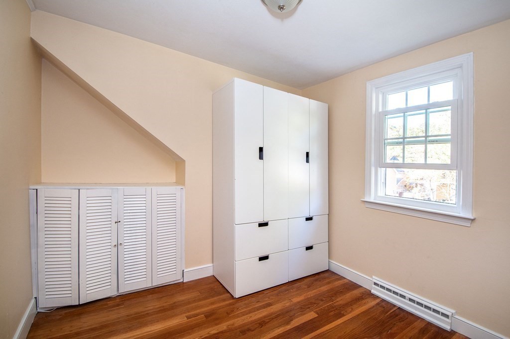 226 Beaver Dam Road Scituate, MA 02066 - Photo 8 of 12 a view of an empty room with wooden floor