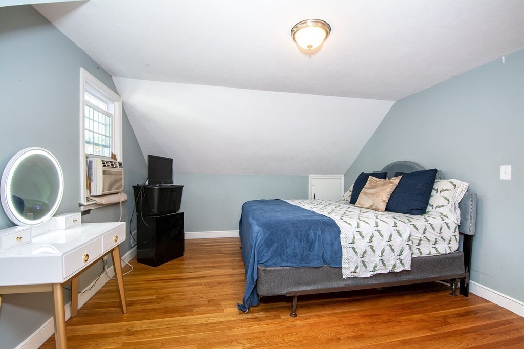 226 Beaver Dam Road Scituate, MA 02066 - Photo 10 of 12 a bedroom with a bed and cabinets