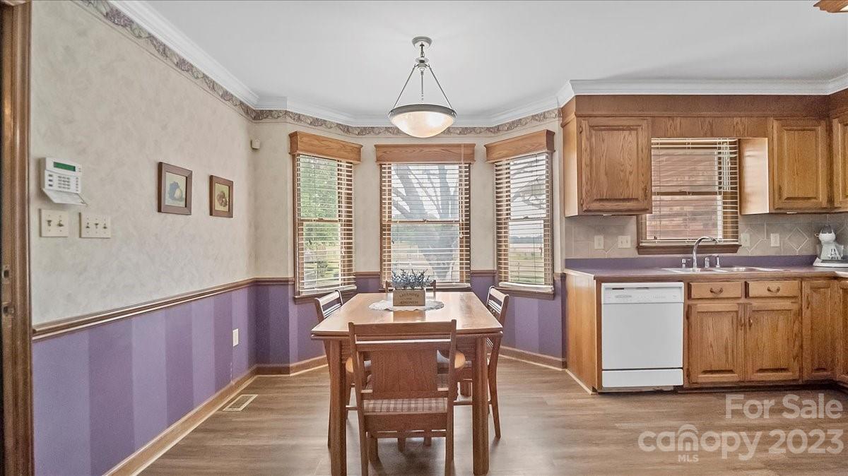 425 Baucom Road Monroe, NC 28110 - Photo 22 of 48 a large kitchen with a large window and cabinets