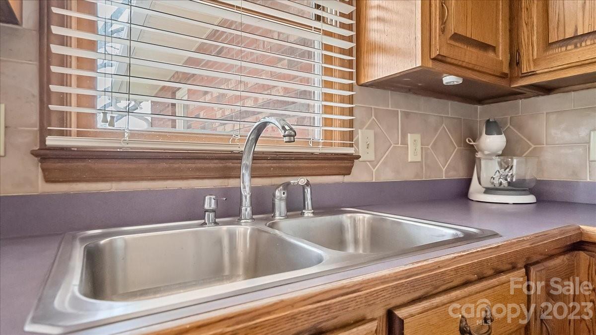 425 Baucom Road Monroe, NC 28110 - Photo 26 of 48 a close view of sink and tap