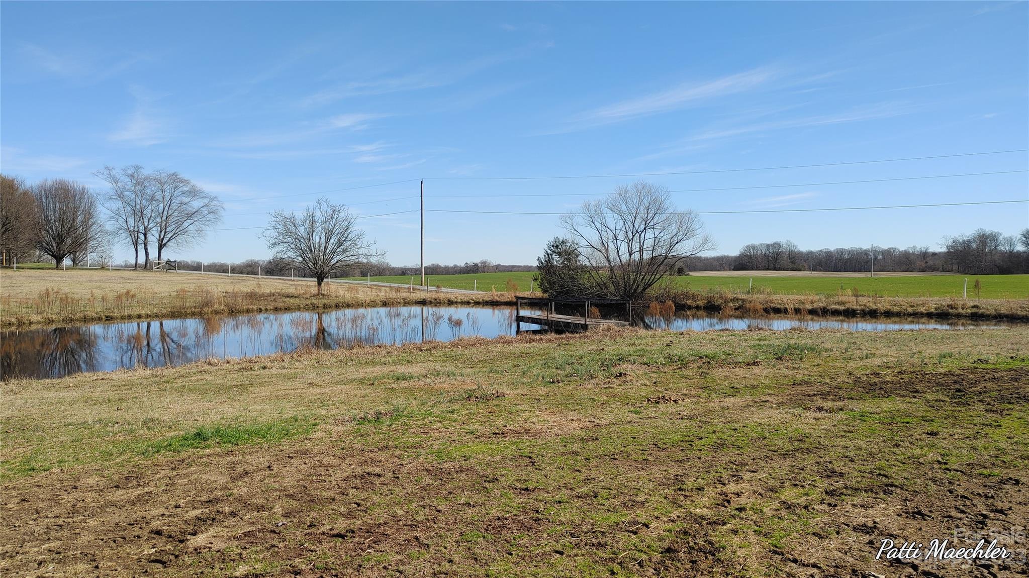 425 Baucom Road Monroe, NC 28110 - Photo 33 of 48 a view of a lake with houses in the background