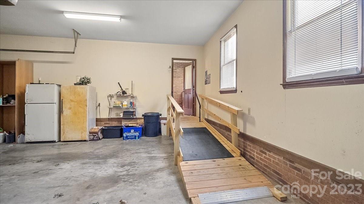 425 Baucom Road Monroe, NC 28110 - Photo 36 of 48 workspace with wooden floor and windows