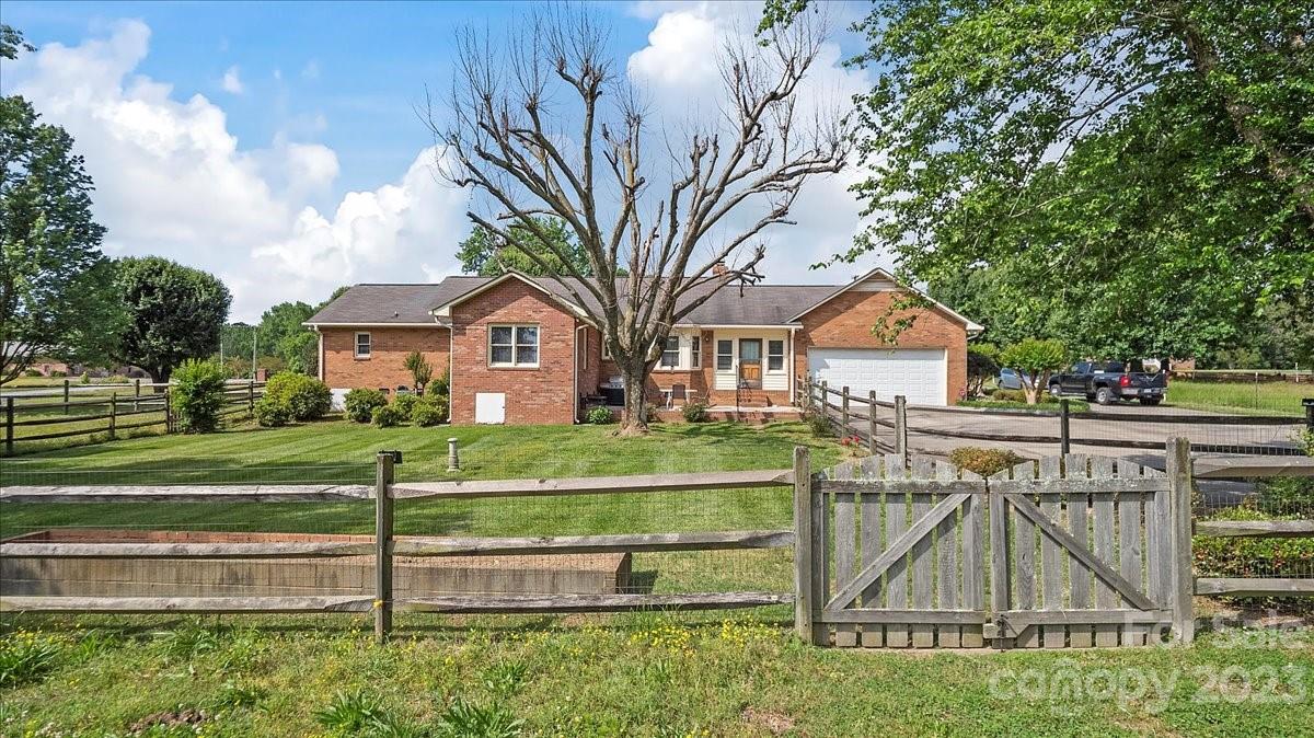 425 Baucom Road Monroe, NC 28110 - Photo 37 of 48 a front view of a house with a yard