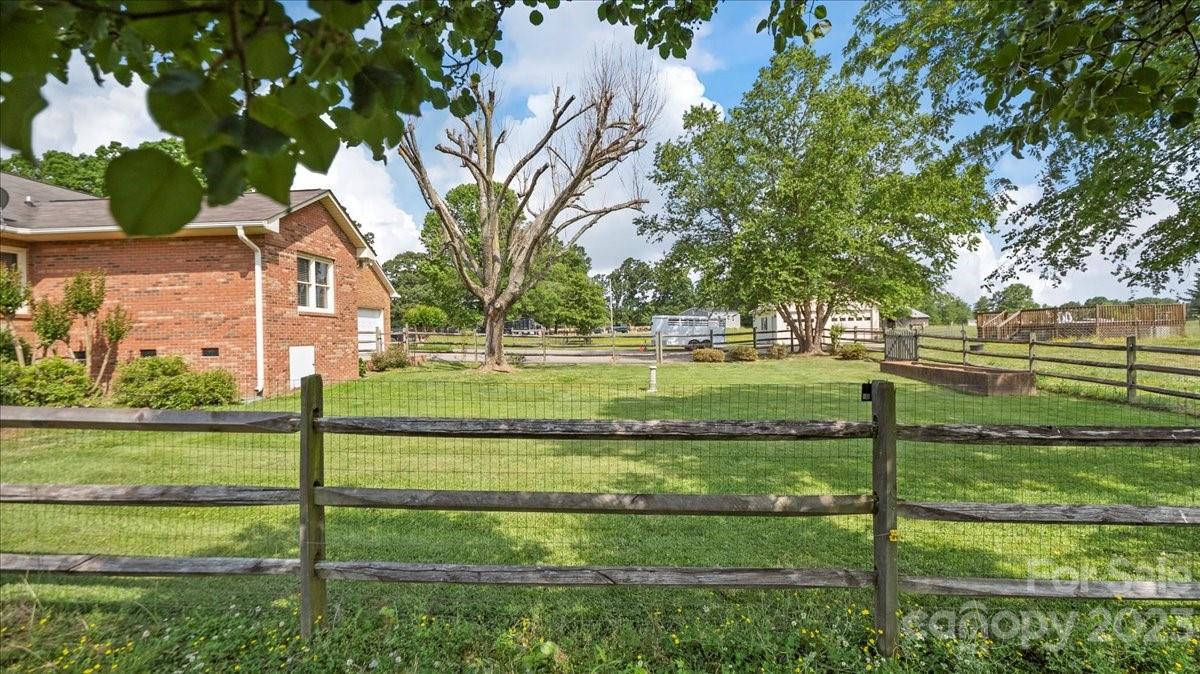 425 Baucom Road Monroe, NC 28110 - Photo 38 of 48 a front view of a house with a yard