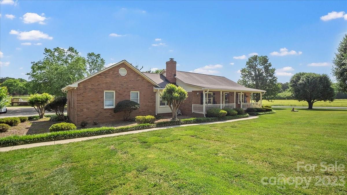 425 Baucom Road Monroe, NC 28110 - Photo 43 of 48 a front view of a house with a yard