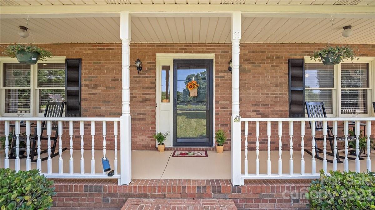 425 Baucom Road Monroe, NC 28110 - Photo 6 of 48 a view of a brick house with large windows