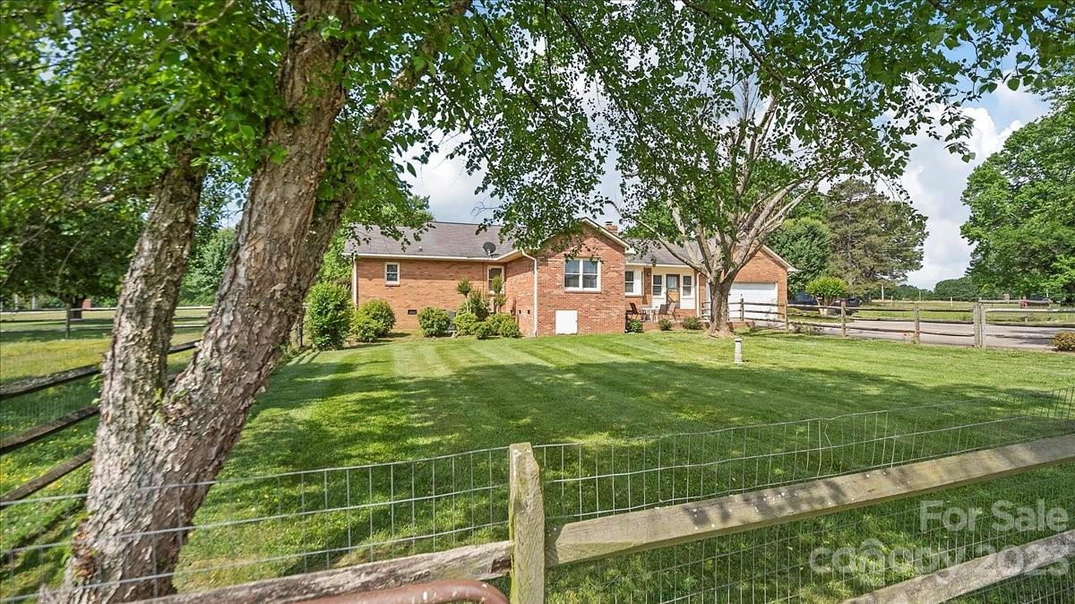 425 Baucom Road Monroe, NC 28110 - Photo 9 of 48 a front view of a house with a yard
