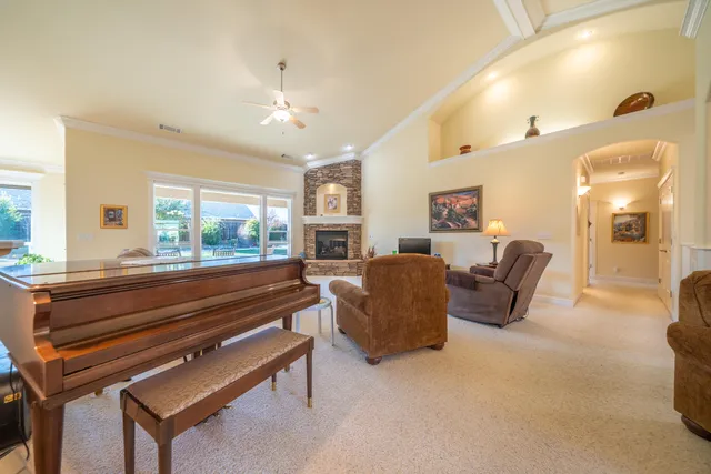 a dining room with furniture a chandelier and a rug