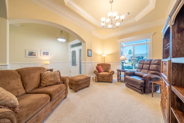 a kitchen with stainless steel appliances granite countertop a sink and a refrigerator