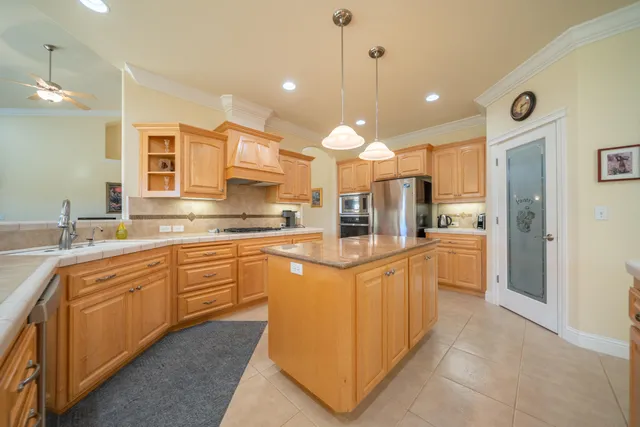 a bathroom with a double vanity sink mirror and shower