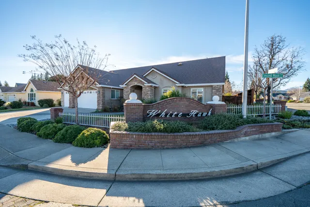 a living room with furniture a chandelier and a couch