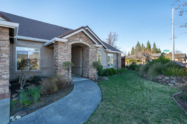 a living room with furniture cabinets and window