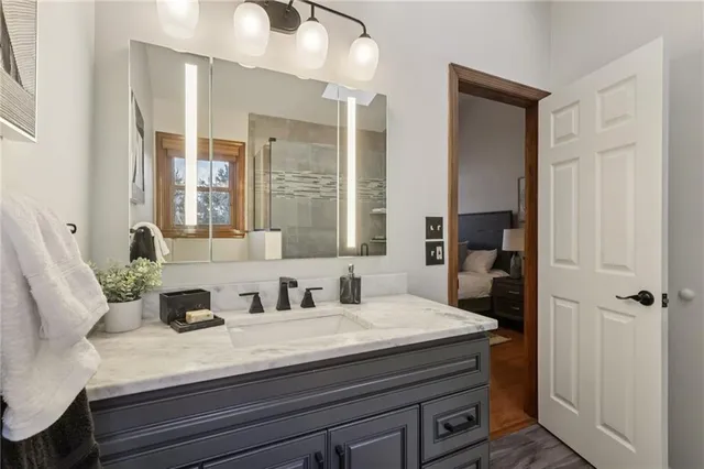 a view of a backyard with chairs and a barbeque