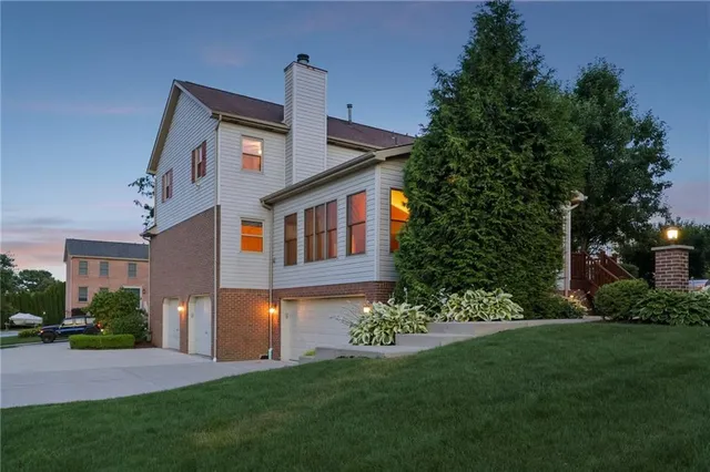a living room with furniture and large windows