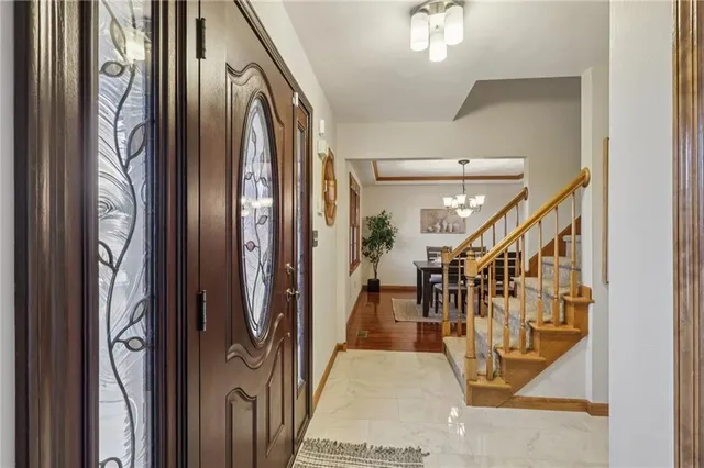 a living room with furniture a fireplace and windows