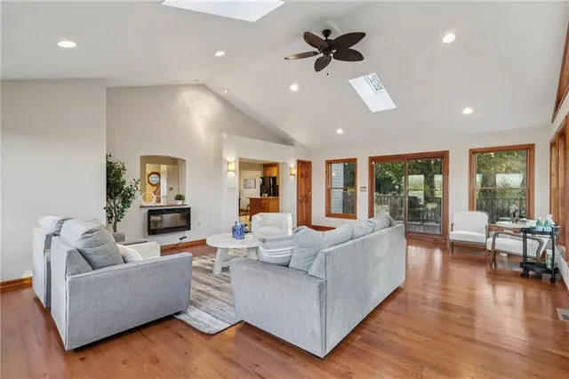 a kitchen with a refrigerator and a stove top oven