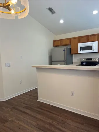 a view of kitchen with wooden floor