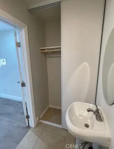 a bathroom with a sink and shower