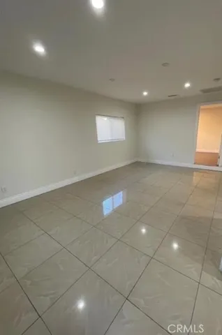 an empty room with a bathroom