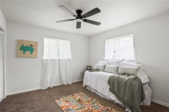 a bed room with a bed and a window