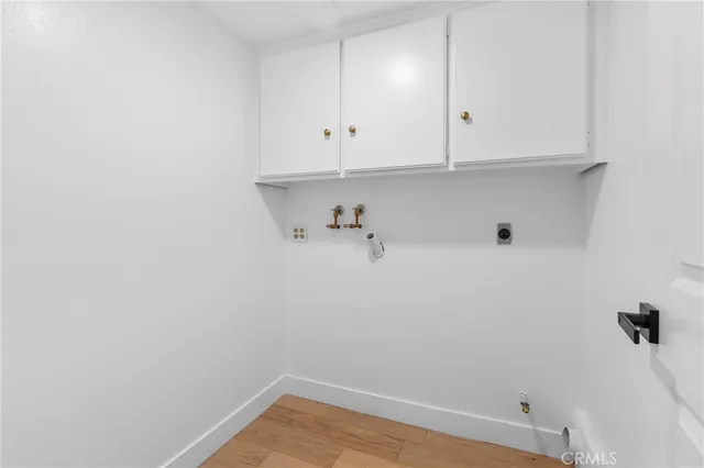 a view of storage and utility room with racks on the wall