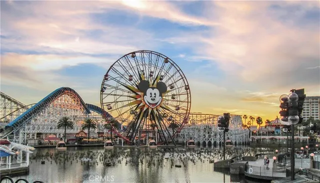 a group of people sitting in front of a house