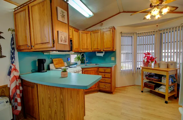a kitchen that has a table and chair in it