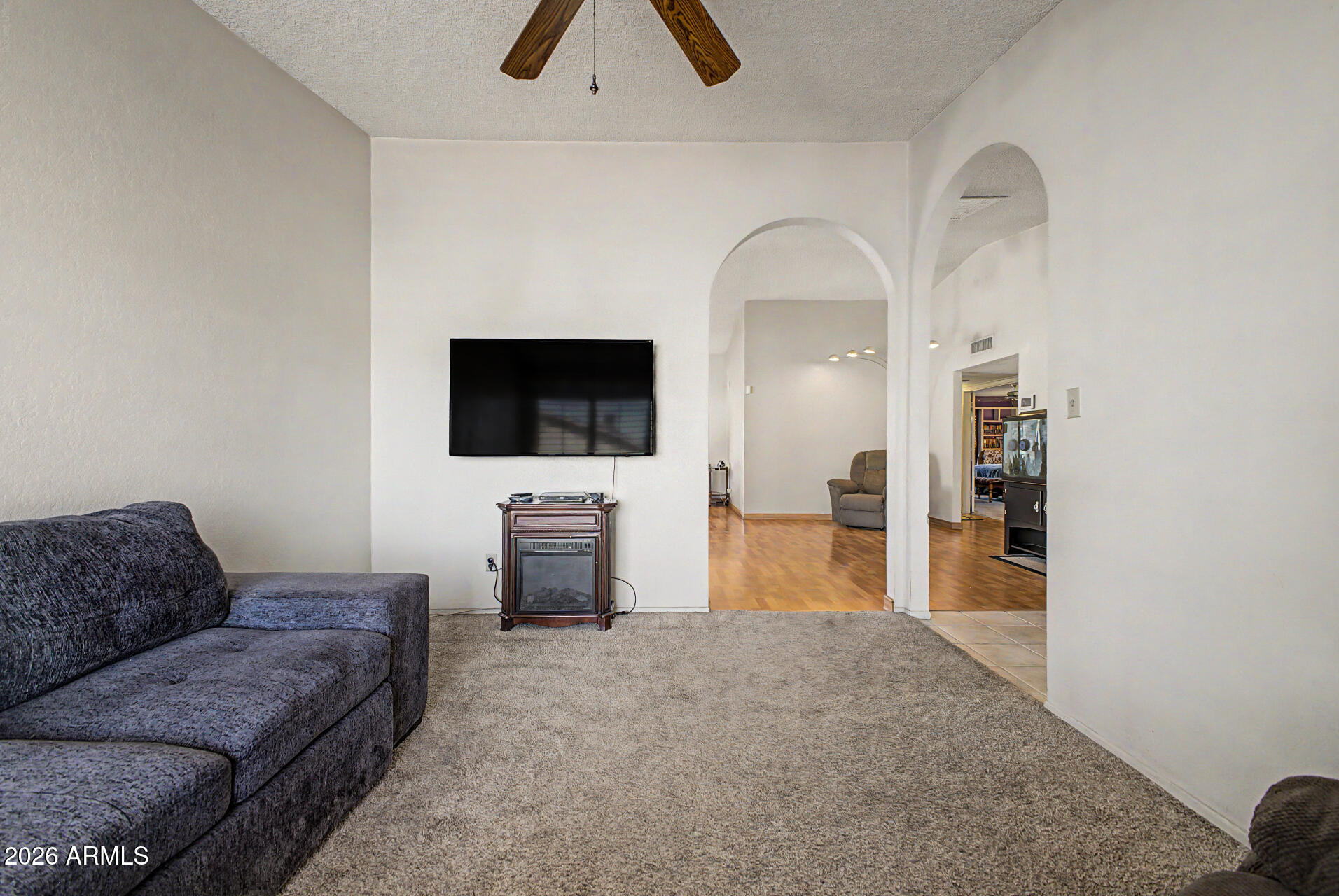 2659 West Hearn Road Phoenix, AZ 85023 - Photo 6 of 25 a living room with furniture and a flat screen tv