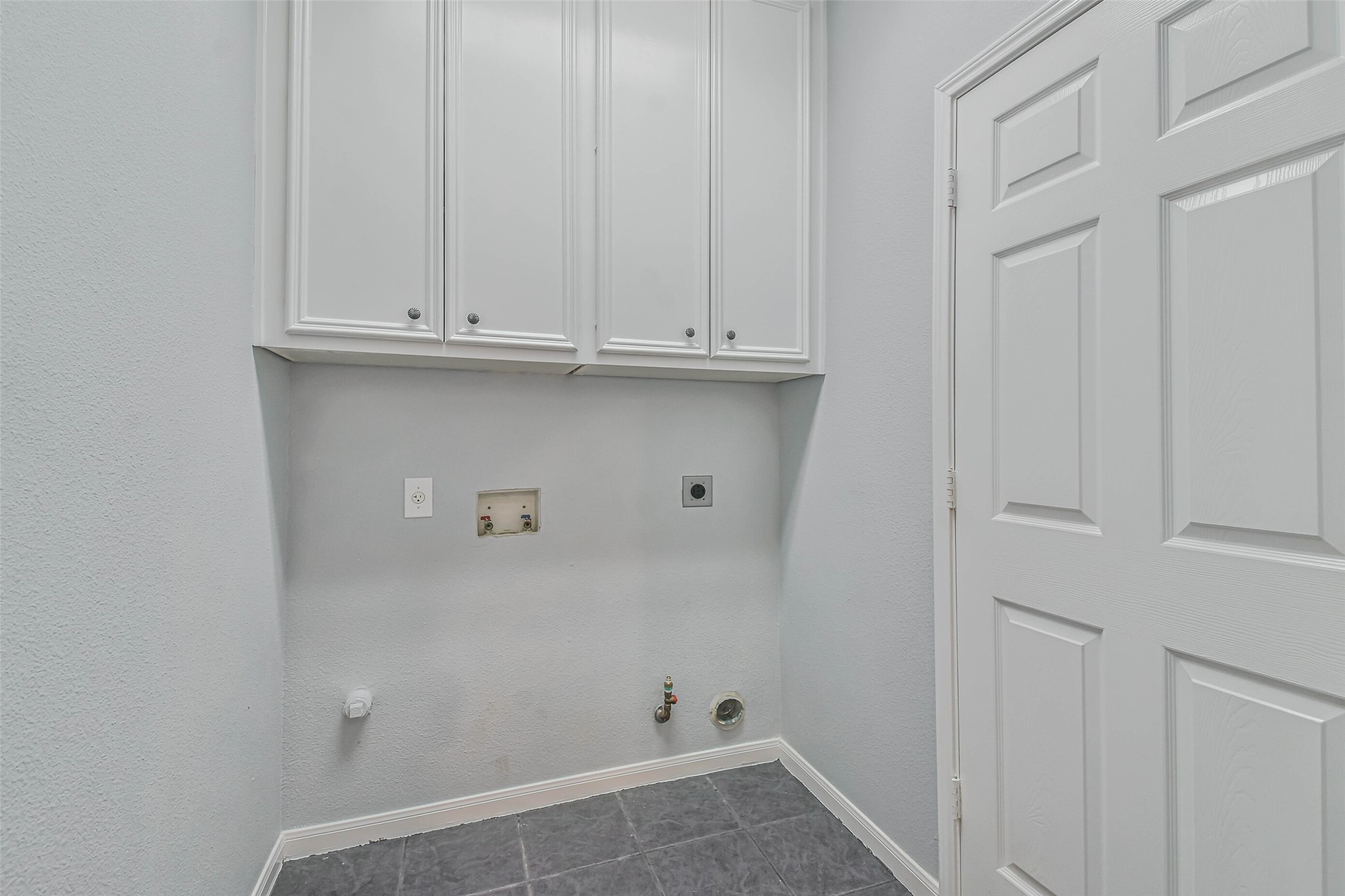 20942 Wind Field Lane Spring, TX 77379 - Photo 40 of 46 a view of storage and utility room with racks on the wall