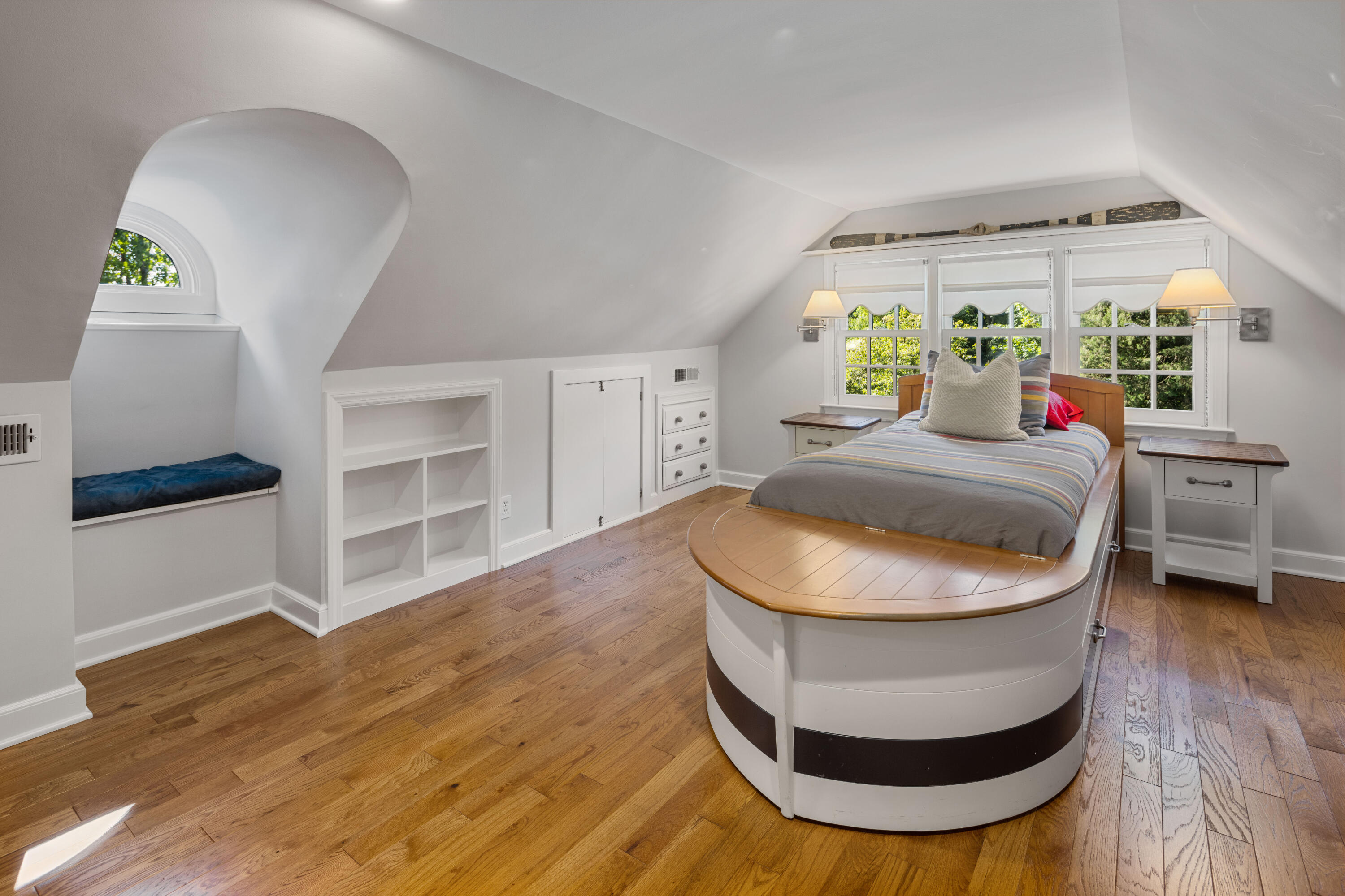 7 Berry Lane Darien, CT 06820 - Photo 22 of 27 a room with wooden floor and a potted plant