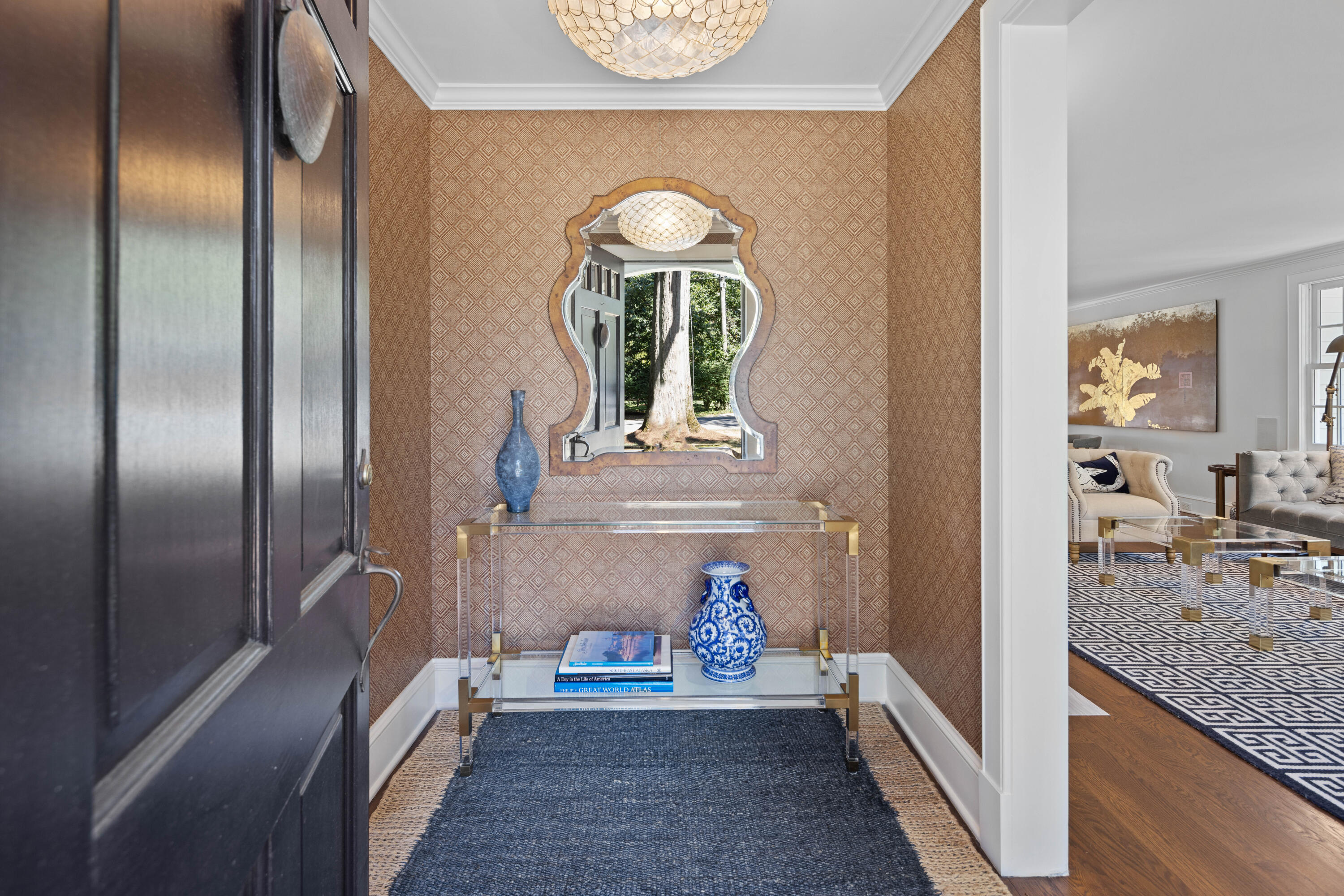 7 Berry Lane Darien, CT 06820 - Photo 7 of 27 a view of a hallway with two windows and a chandelier