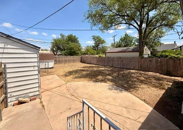 4623 Crockett Street Amarillo, TX 79110 - Photo 5 of 9 a view of a backyard