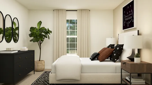 a bedroom with a bed a potted plant and a window
