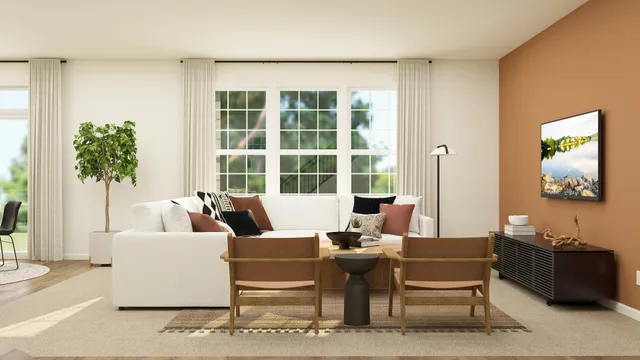 a living room with furniture and a potted plant