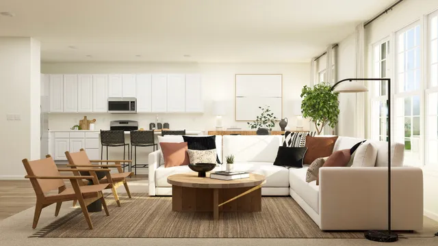 a living room with a couch dining table and a refrigerator